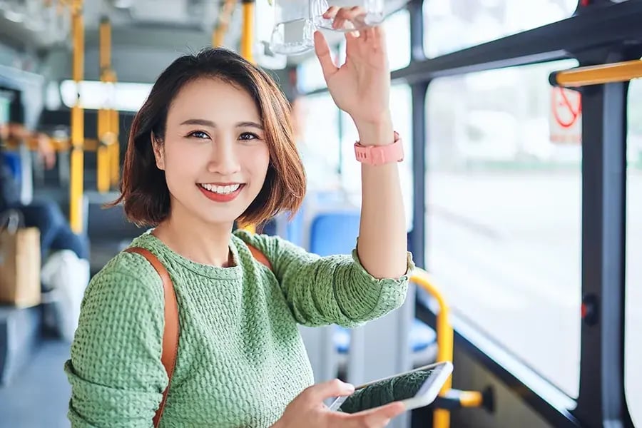 AsianWomanSmilingSubway.png