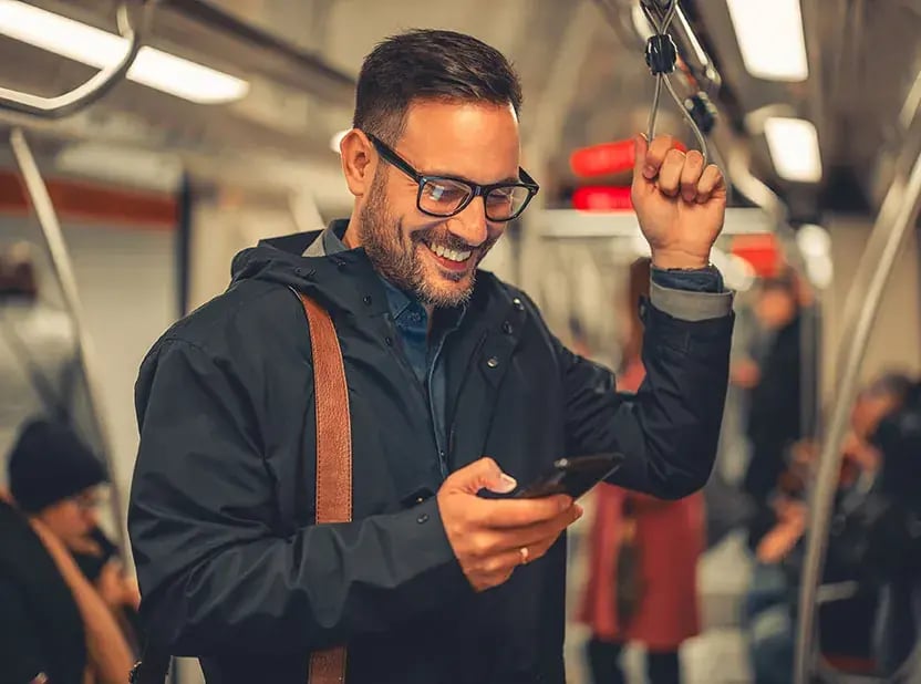 ManonTrainlookingatphone.jpg
