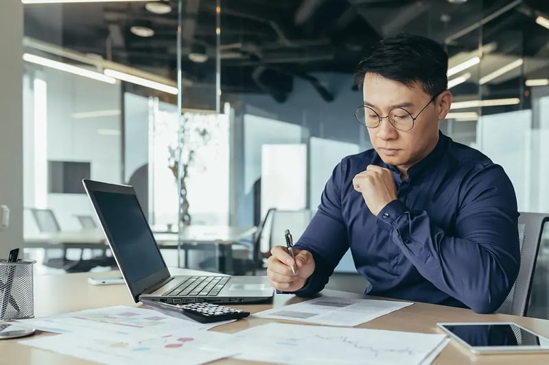 IT worker assessing risk at desk